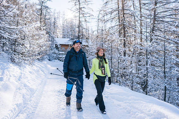 Snow-covered trail with person walking in winter gear