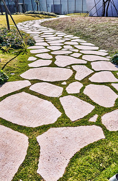 Gravel path through green meadow